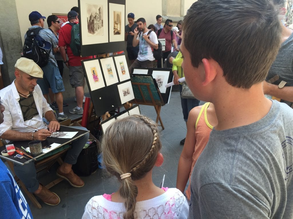 Kids checking out the street art while in Italy. Things to do in Rome with Kids | Global Munchkins