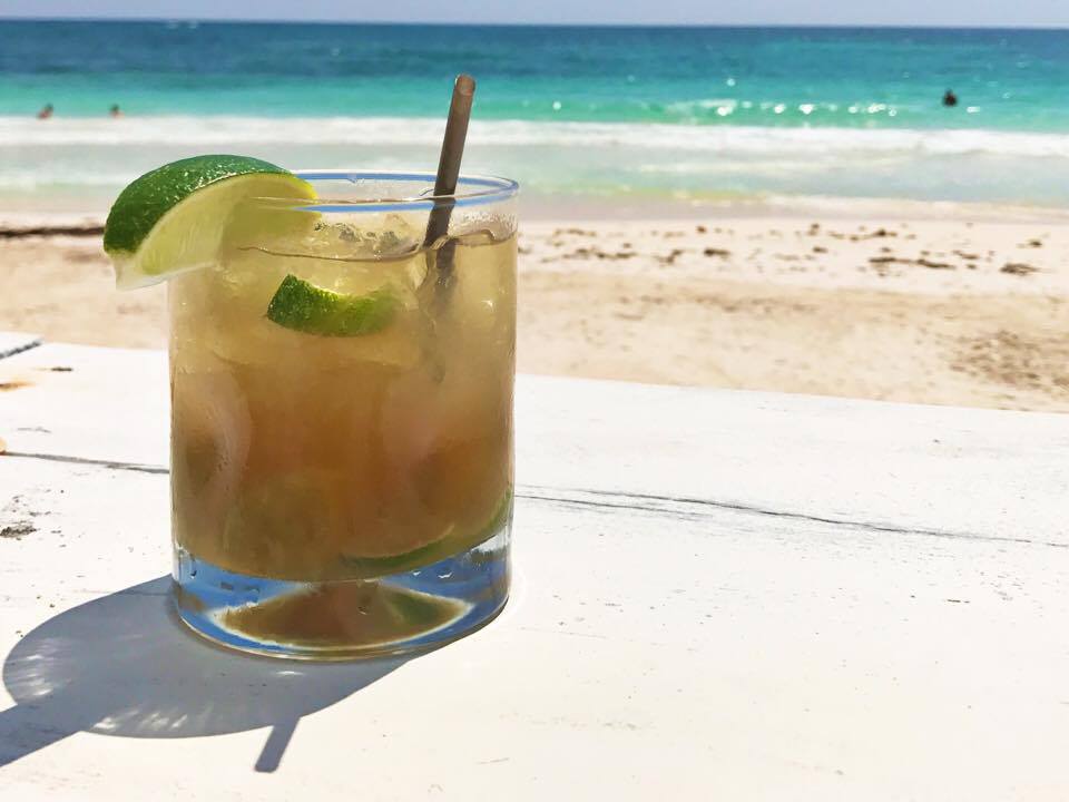 Drink on a Tulum Beach at eco-chic Coco Tulum resort.