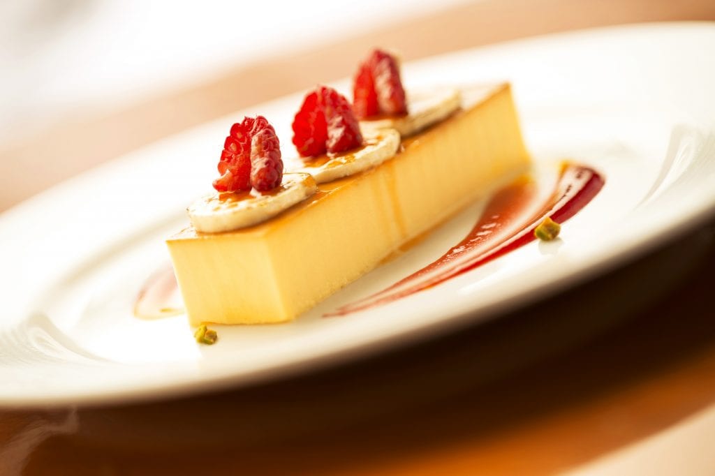 De La Costa Cream Cheese Flan with caramel bananas and Pedro Ximenez reduction sauce in Carioca’s on the Disney Magic. (Kent Phillips, photographer)