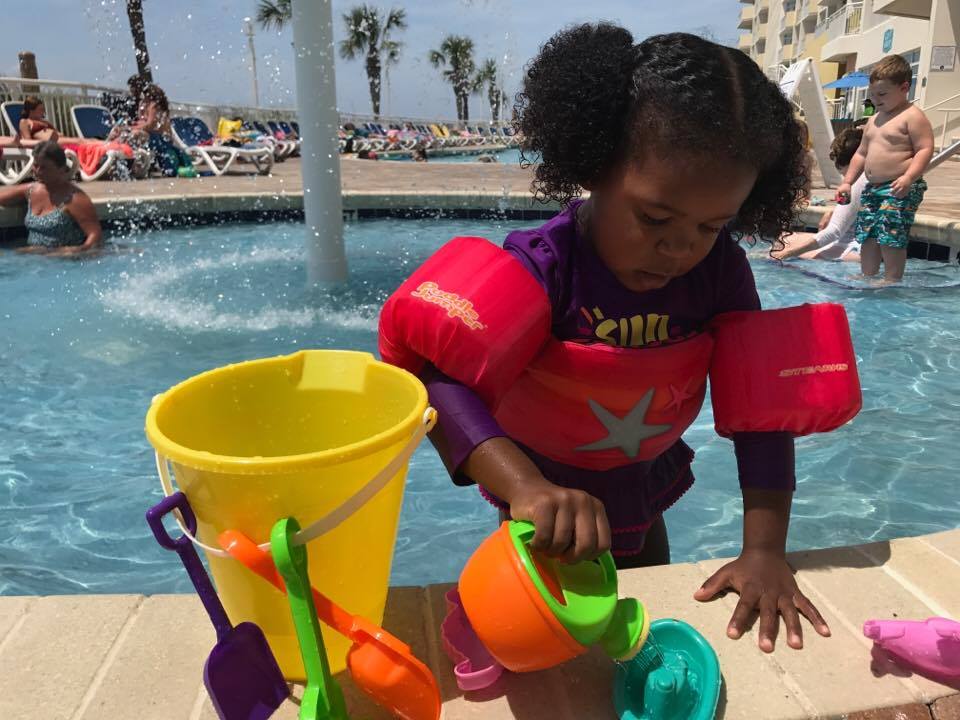 Liv playing at a pool at our Wyndham Vacation Rental