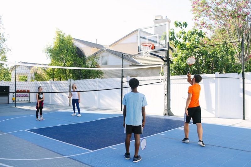 Our backyard court from Sport Court is a Multi-Game Court featuring Basketball, Badminton, Pickleball, Volleyball, Tetherball, and Four Square. It's incredibly versatile.