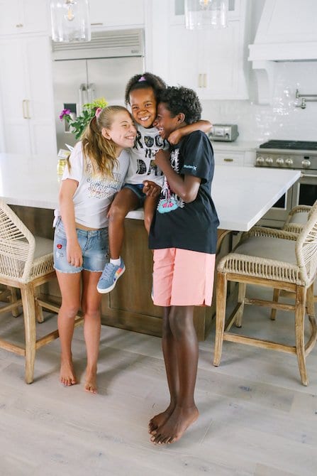 Adoptive family in gorgeous white kitchen