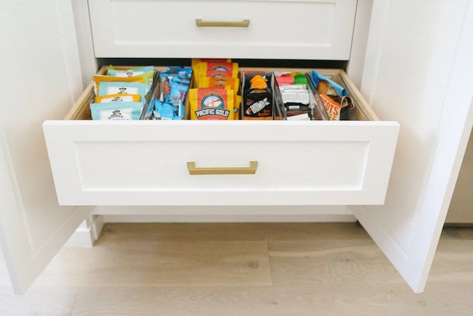 Custom White Kitchen with snack drawer. Kitchen Organization. 