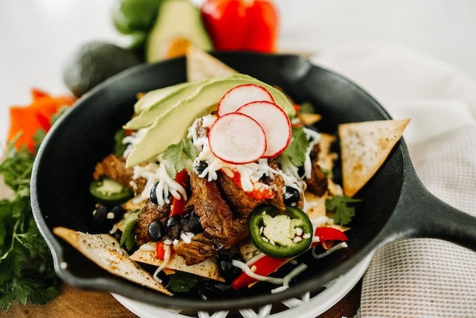 gorgeous cast iron skillet with steak keto nachos