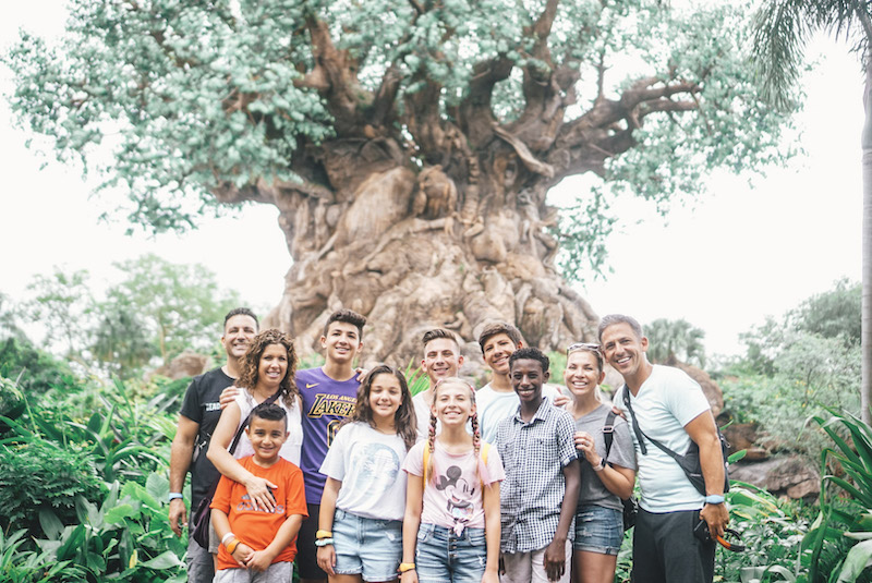 family photo in front of Tree of Life in Animal Kingdom