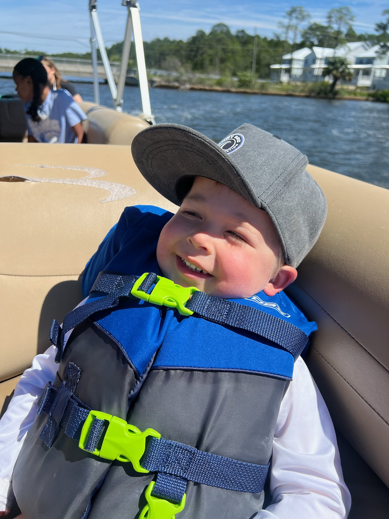 toddler in lifejacket on boat in 30A florida