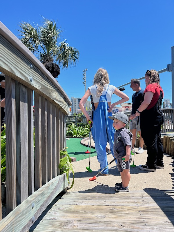 kids playing mini golf