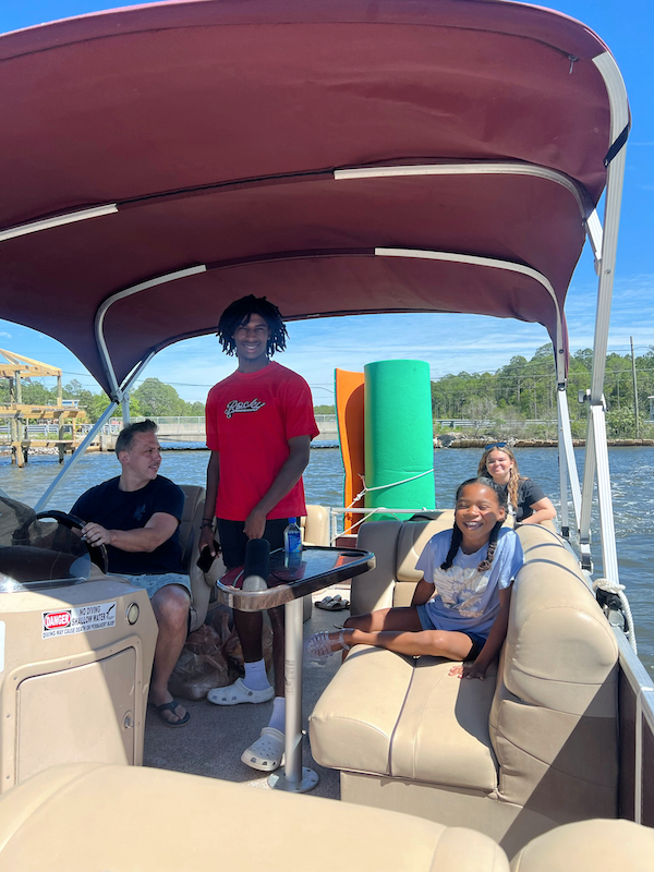 family on pontoon boat in 30A