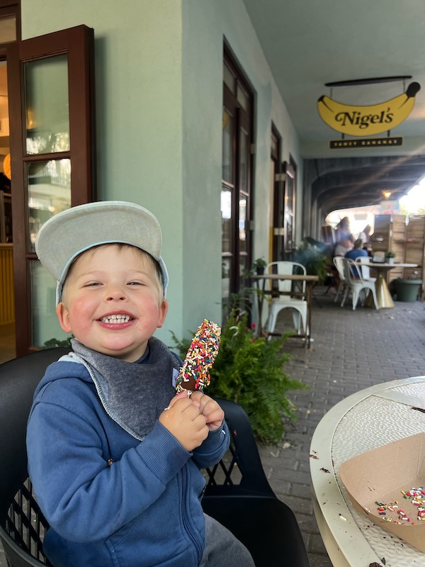 toddler eating dessert at Nigel's Bananas