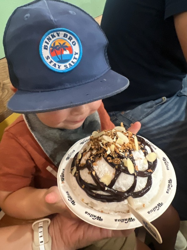 toddler eating shave ice in kauai